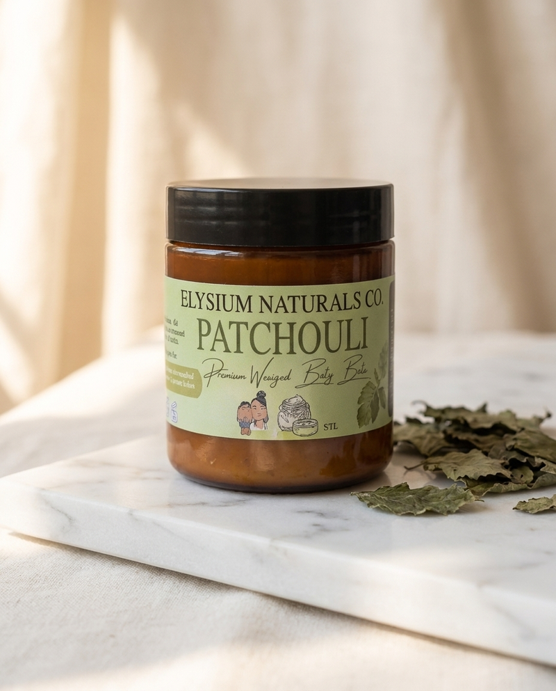 Patchouli Whipped Body Butter jar with patchouli leaves on marble — Elysium Naturals Co.